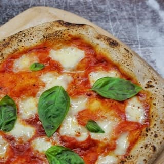 A margherita pizza fresh from the oven